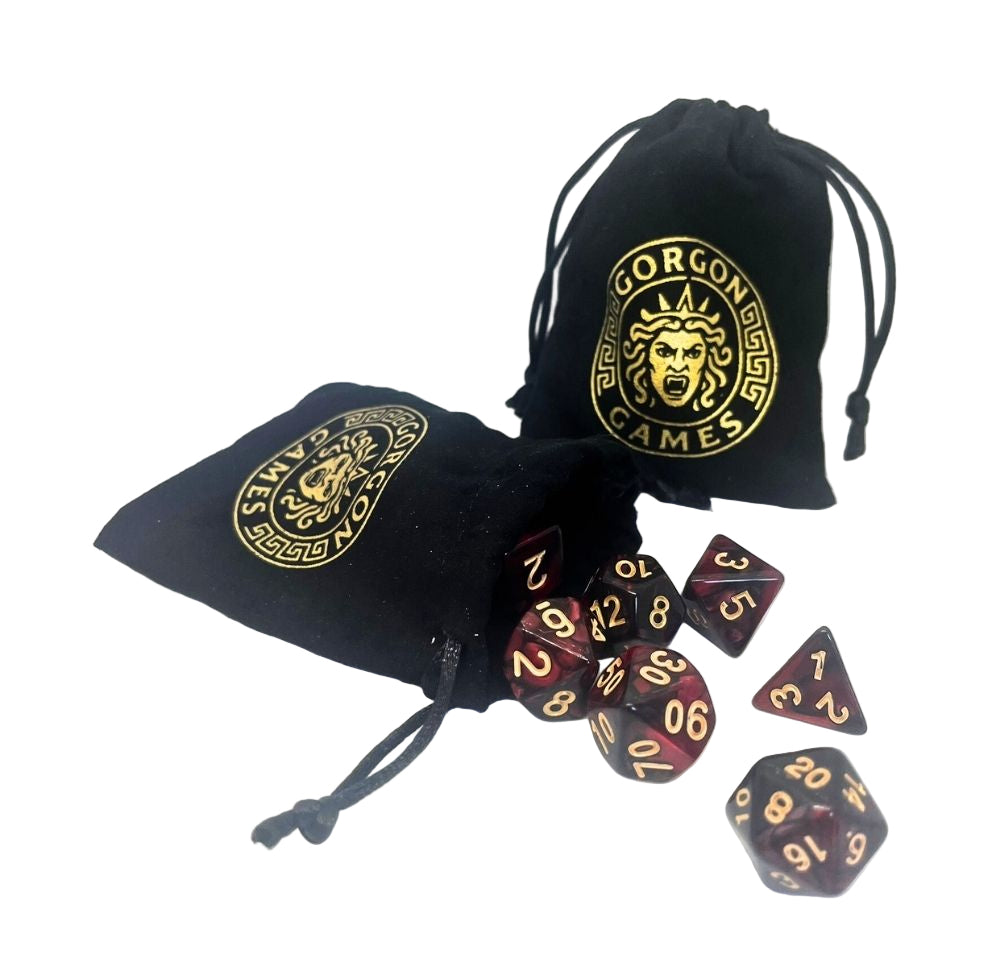Black drawstring bags with Gorgon Games logo and polyhedral dice on a white background