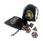 Black drawstring bags with Gorgon Games logo and polyhedral dice on a white background