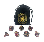 Set of polyhedral dice with Gorgon Games logo drawstring bag on a white background