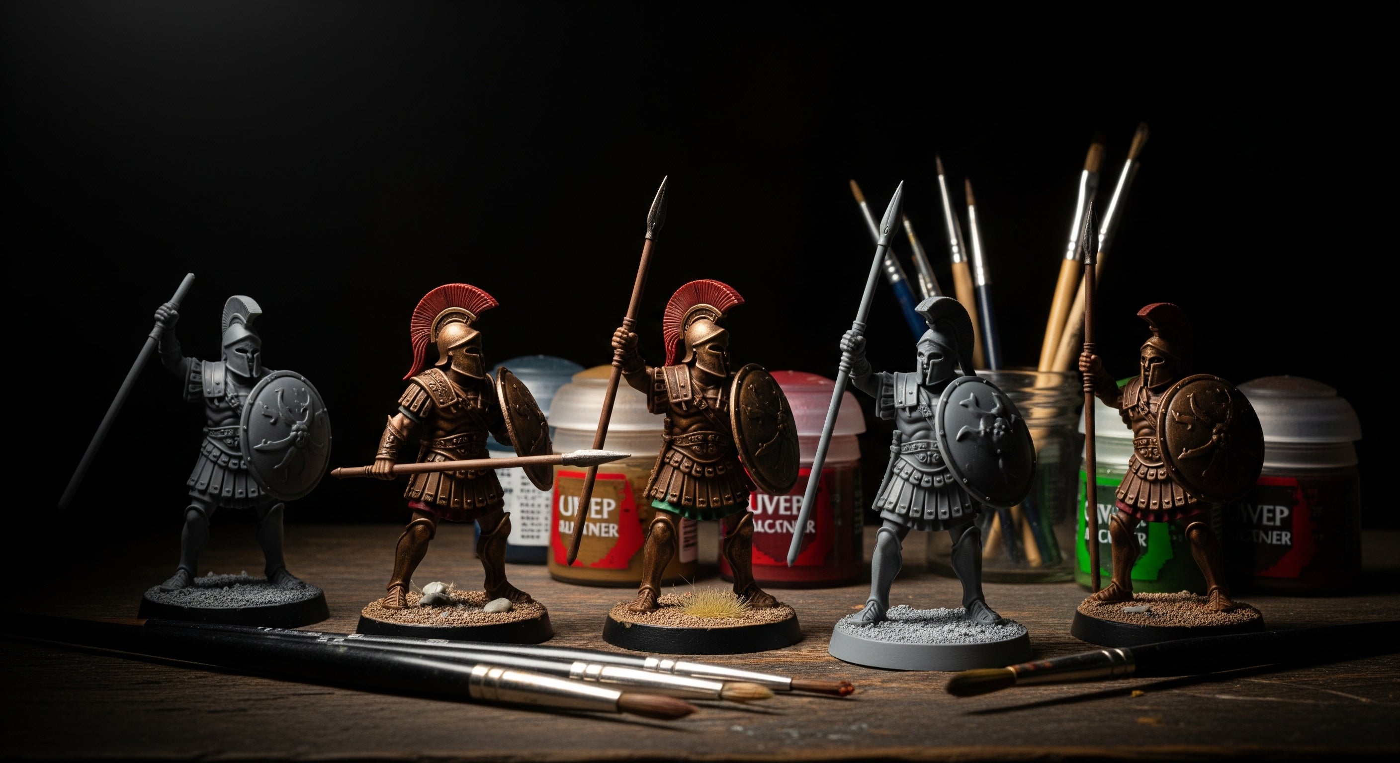 Set of Roman warrior figurines with shields and spears on a dark background