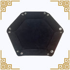 Hexagonal black dice tray flat with metallic studs on a white background