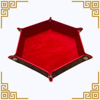 Red hexagonal dice  tray with brown edges on a white background