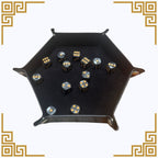 Black dice tray with dice on a white background