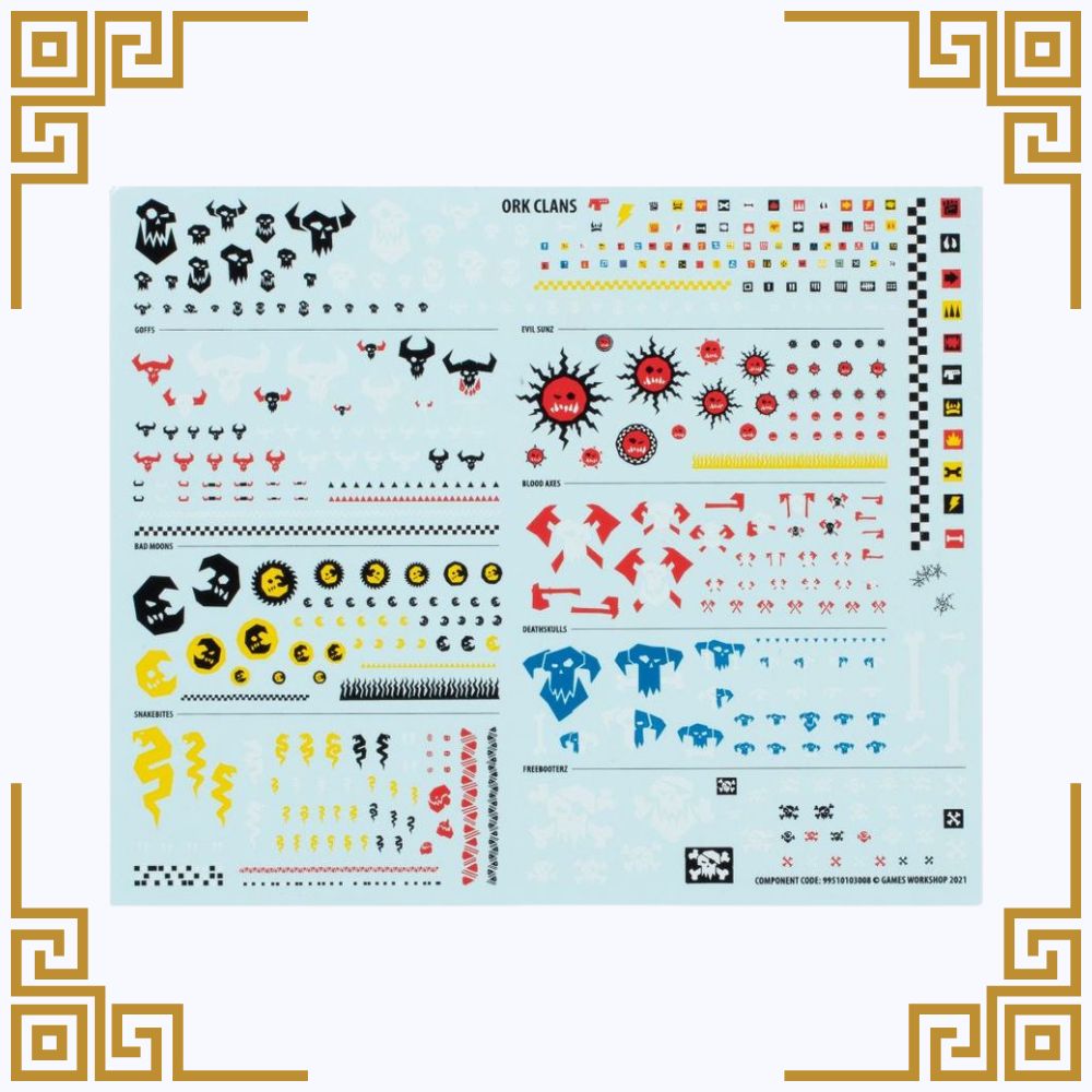 Sheet of miniature decals with various symbols and designs on a light blue background